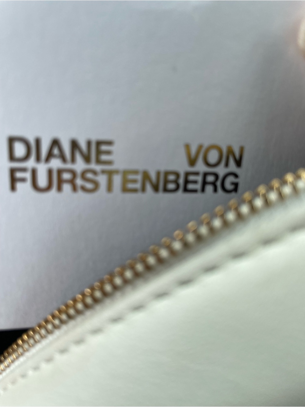 Diane Von Furstenberg White Leather Zip round bag with Gold Hardware